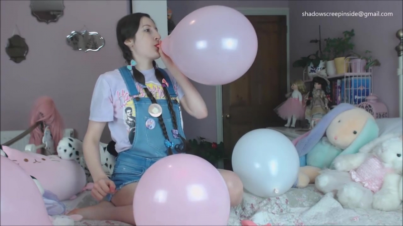 Girls Blowing Balloons